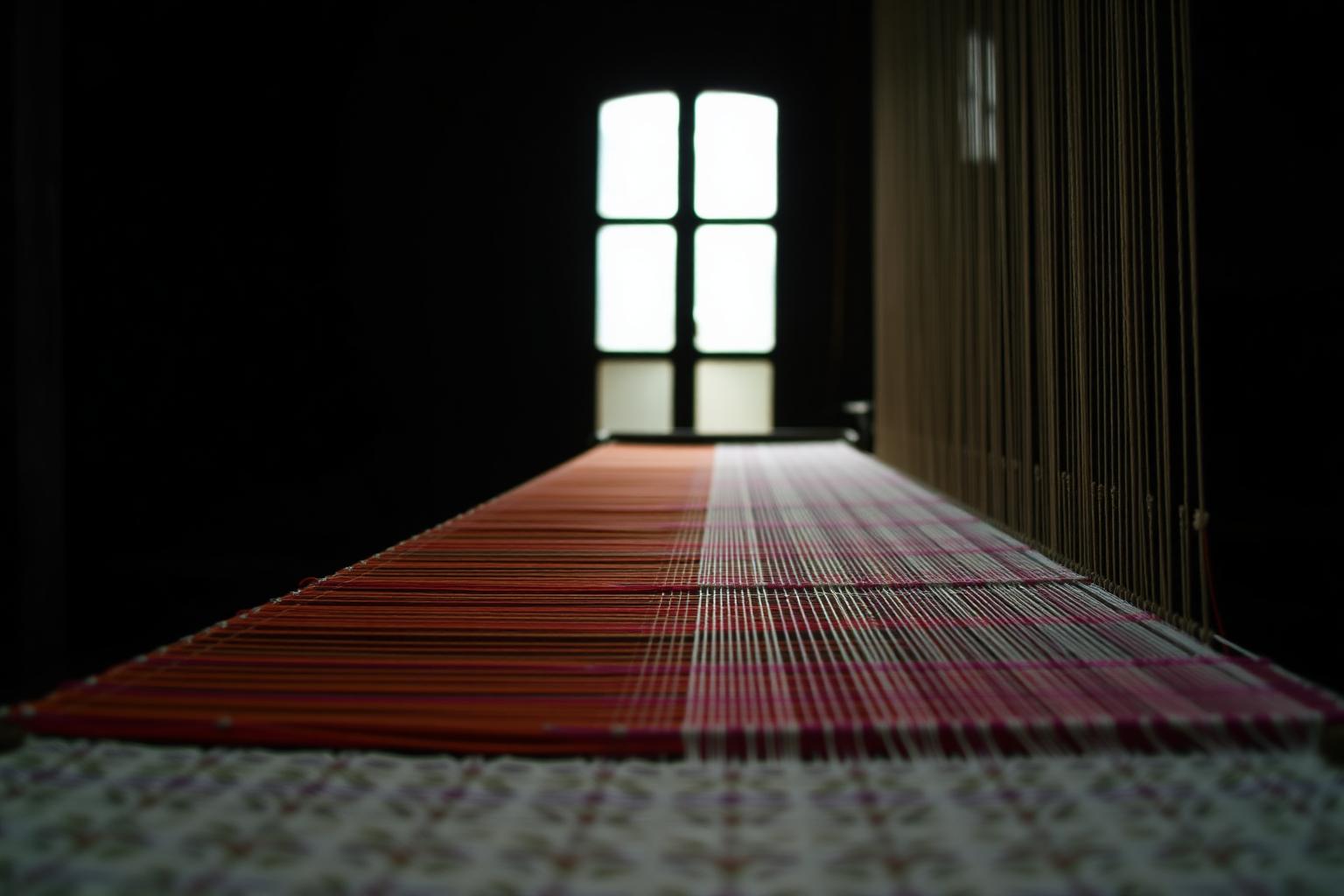 Loom mid-weave in the Gianyar studio