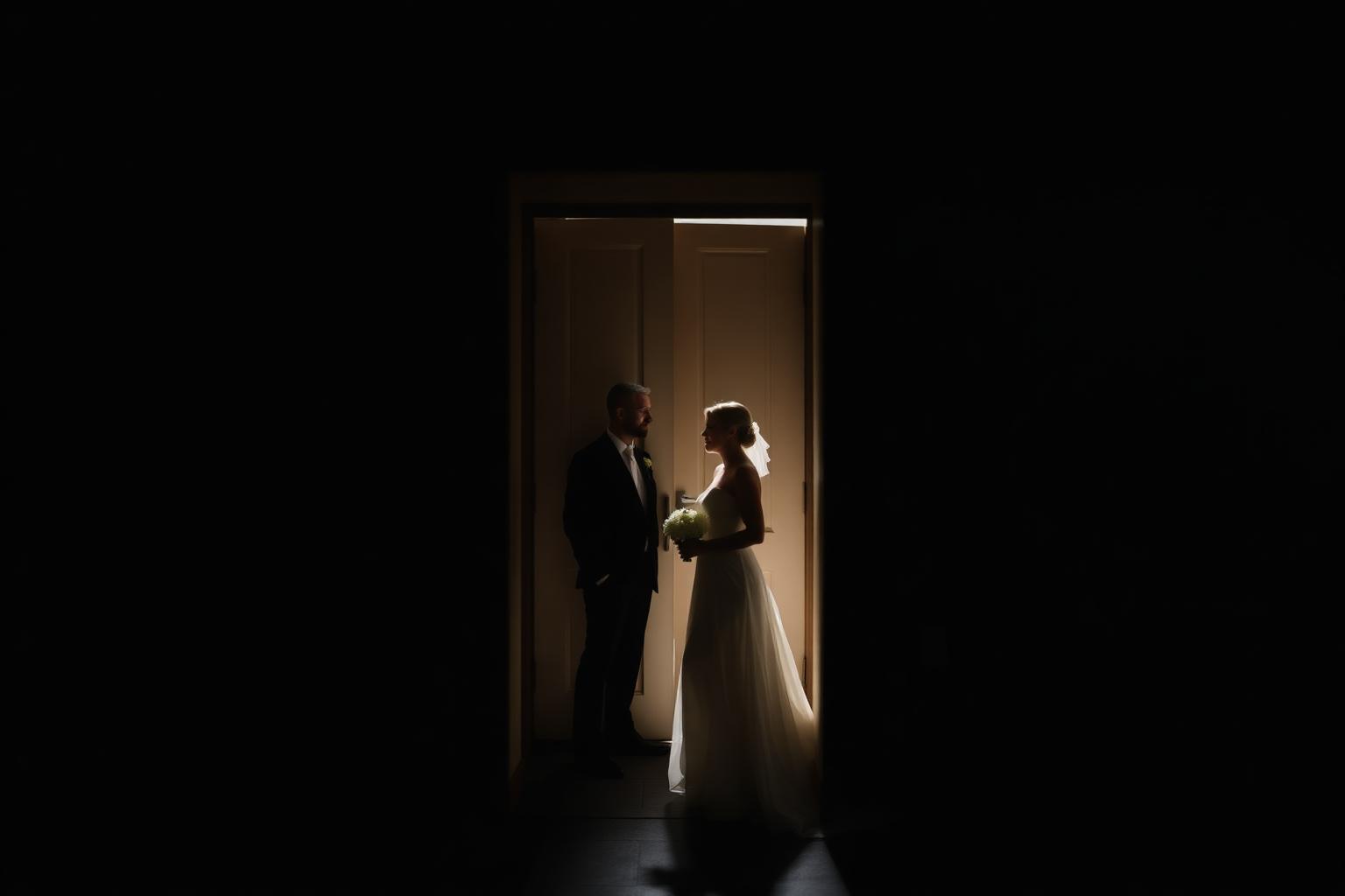 Quiet portrait of the couple in the doorway